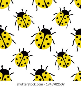 Seamless pattern with flat yellow ladybugs on a white background.