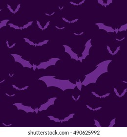 Seamless pattern flock of bats on a Violet background. Illustration for your design for Halloween. Vector EPS10.