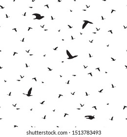 Seamless pattern flock of black birds silhouette flying on white background. Elegant animal fly print, modern motif fabric textile cloth or wall paper, vector design eps 10