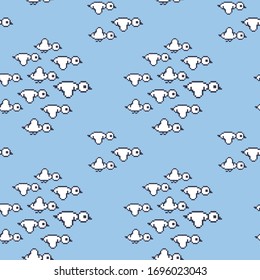Seamless pattern. A flock of flying birds. Pixel birds on a blue background. Migratory bird . Vector illustration
