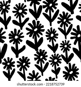 Seamless pattern with floral brush strokes chamomile. Hand drawn chamomile or daisy painted by brush. Botanical ornament . Black flowers with leaves on stems. Doodle texture with meadow flowers.