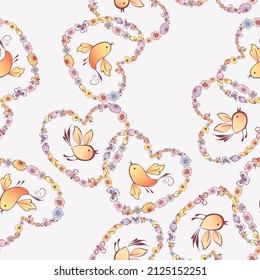 Seamless pattern of floral heart shapes from various abstract colorful flowers and flying cartoon birds