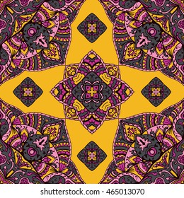 Seamless pattern of floral mandala on a yellow background. Oriental ornament. Template for carpet, shawl, wallpaper, embroidery.