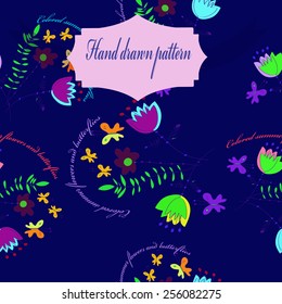 Seamless pattern of floral motif,circular text,  label    on a dark blue      background. Hand drawn.