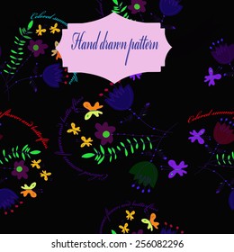 Seamless pattern of floral motif,circular text,  label    on a  black     background. Hand drawn.