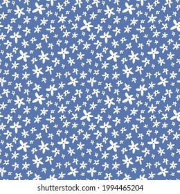 Seamless pattern in floral style. White Small Flowers on Blue Background. Vector Illustration
