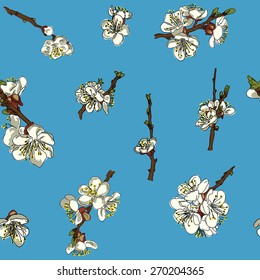 Seamless pattern of flowers of an Apple tree on a blue background