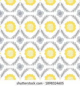 Seamless pattern with flowers and branches on white background. Trendy colors of 2021 - Illuminating Yellow and Ultimate Grey. Perfect for spring and summer holidays, gift paper, fabric