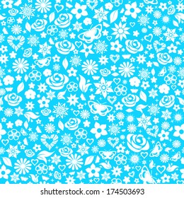 Seamless pattern of flowers, leafs, stars, butterflies and hearts. White on light blue.