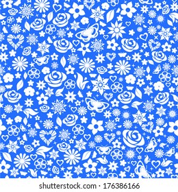 Seamless pattern of flowers, leafs, stars, butterflies and hearts. White on blue.