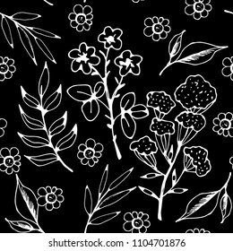 Seamless pattern with flowers, leaves, herbs. Floral background texture. Fabric design in black and white