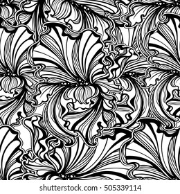 seamless pattern of flowers and leaves of irises in vintage style Art Nouveau. Gold on a black background