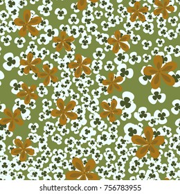 Seamless pattern. Flowers and leaves are scattered chaotically. Fashionable camouflage.