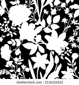 Seamless pattern with flowers on a black background. Monochrome illustration. Silhouettes. Endless design with delicate wild flowers for printing and decoration. Repeatable botanical backdrop.