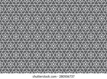 Seamless Pattern of Flowers of Six Petals in Hexagonal Grids.  White Patterns on Gray Background.