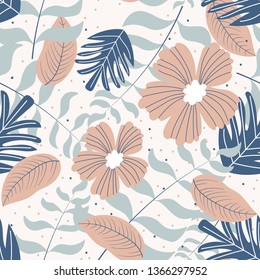 Seamless pattern of flowers and tropical leaves.  Vector design.