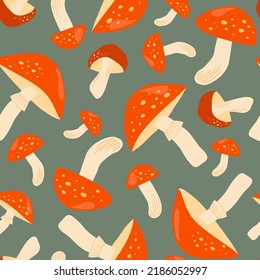 Seamless pattern with fly agarics. Autumn poisonous mushrooms. Simple plant abstract print. Vector graphics.