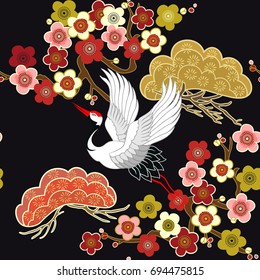 Seamless pattern with flying birds. Crane. Heron. Japanese pattern. Ornament with oriental motifs. Vector.