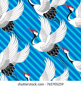 Seamless pattern with flying birds. Crane. Heron. Japanese pattern. Ornament with oriental motifs. Vector.