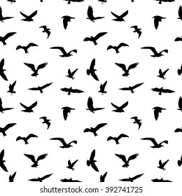 Seamless pattern of flying birds silhouettes on white background. Vector illustration