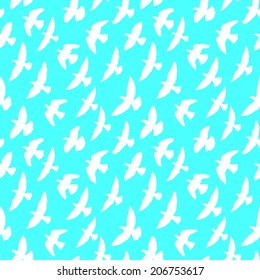 Seamless pattern of flying birds. White silhouette on a blue background. Two colors. Vector endless texture.