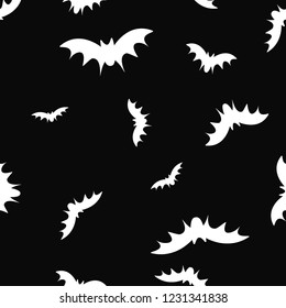 Seamless pattern with flying black bats silhouettes on black background for Halloween. Vector illustration. Autumn party. Trick or treat. 