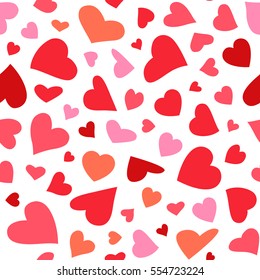 Seamless pattern with flying hearts in different colors