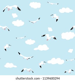 seamless pattern flying seagull with clouds on blue background, vector illustration