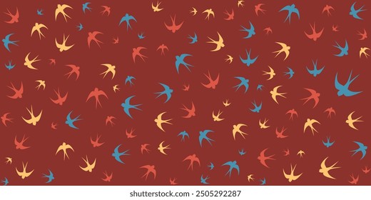 Seamless pattern of flying swallows in different colors on a red background. Perfect for wallpaper, fabric, or any design project.