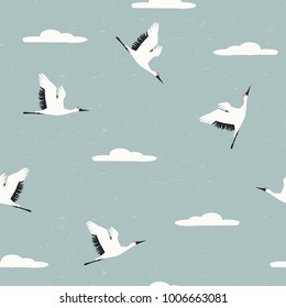 Seamless pattern with flying white crane in the sky. Vector hand drawn illustration.