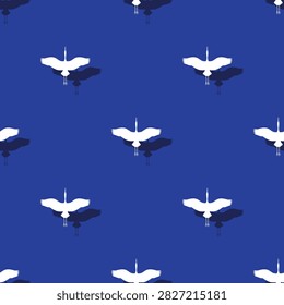 Seamless pattern with flying white storks or cranes and shadows on dark blue background