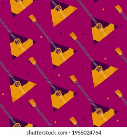 Seamless pattern with folk music instruments on purple background. Design for fabric and paper, surface textures.