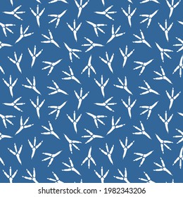 Seamless pattern with footprint of a bird. Vector seamless background with a pattern of traces of bird steps. Raven footprints seamless pattern. Footprints in the blue snow. Fabric textile print