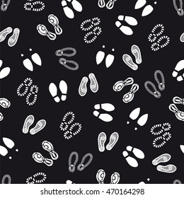 Seamless pattern with footprint on black background. Vector illustration
