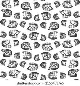 Seamless pattern with a footprint of shoes. Vector illustration.