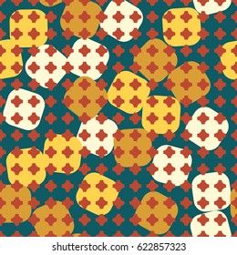 Seamless pattern. In the foreground rows of squares with cropped corners. In the background large squares with rounded edges arranged in a random order. Green, yellow, beige,  brown.