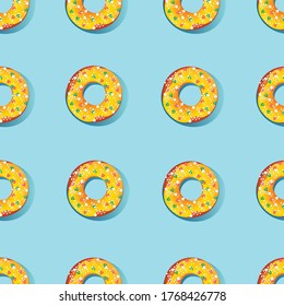 Seamless pattern in the form of confectionery products. Sweet donuts on a light blue background. Vector design.
