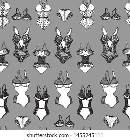 Seamless pattern in the form of lacy underwear for women, drawn on paper by hand, with a black-and-white outline. Graphics, calligraphy.

