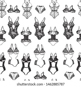 Seamless pattern in the form of lacy underwear for women, drawn on paper by hand, with a black-and-white outline. Graphics, calligraphy.

