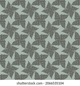 seamless pattern in the form of an ornament of leaves in green tones for printing on fabric, packaging and for interior decoration and for backgrounds of cards and posters