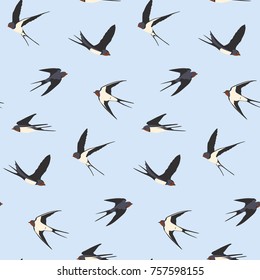 Seamless pattern of four colored swallow silhouettes on a light blue background. Flying birds in different views. Vector Design element.