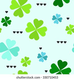 Seamless pattern with four leaf clover leaves with black hearts on the blue background 