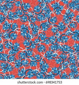 Seamless pattern. Four-sided colored figures. Flower motifs. Random order. Grunge style. Blue tones, white, red.