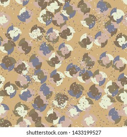 Seamless pattern. Four-sided multi-colored round elements are arranged randomly. Colors of the autumn landscape. Shades of brown and yellow.