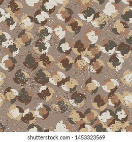 Seamless pattern. Four-sided multi-colored round elements are arranged randomly. Colors of the autumn landscape. Shades of brown and yellow.