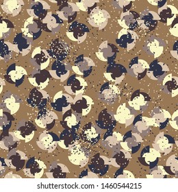 Seamless pattern. Four-sided multi-colored round elements are arranged randomly. Colors of the autumn landscape. Shades of brown and yellow.
