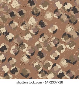 Seamless pattern. Four-sided multi-colored round elements are arranged randomly. Colors of the autumn landscape. Shades of brown and yellow.