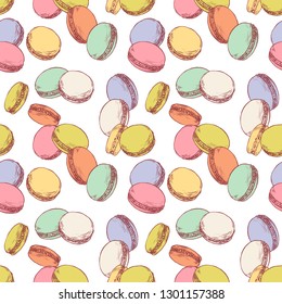 Seamless pattern with french macaroons. Hand drawn vector illustration in vintage engraving style on white background. Sweet colorful dessert.