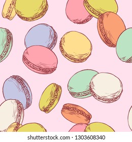 Seamless pattern with french macaroons. Hand drawn vector illustration in vintage engraving style on pink background. Sweet colorful dessert.