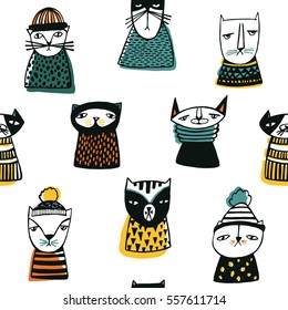 Seamless pattern with funny cartoon cats muzzles. Hand drawn doodle kitty on white background.